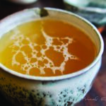 A cup of homemade bone broth recipe.