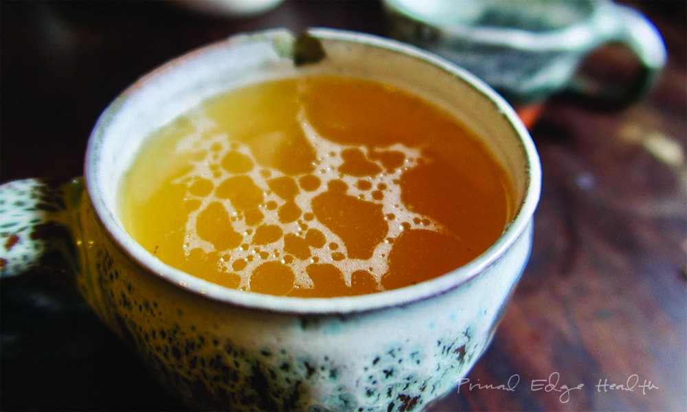 A cup of homemade bone broth recipe.