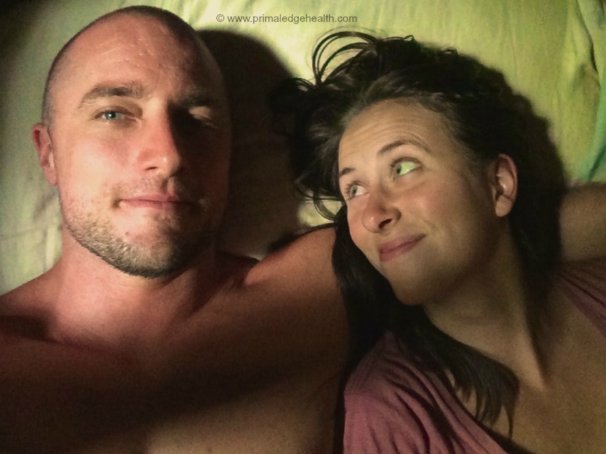 Husband and wife in ketosis laying next to each other.