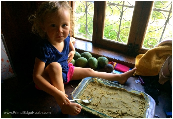 A child enjoying healthy food in a dish.