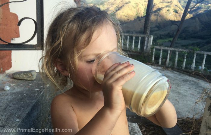 A child enjoying a healthy drink.