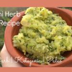 A serving of low-carb zucchini herb butter in a brown bowl.