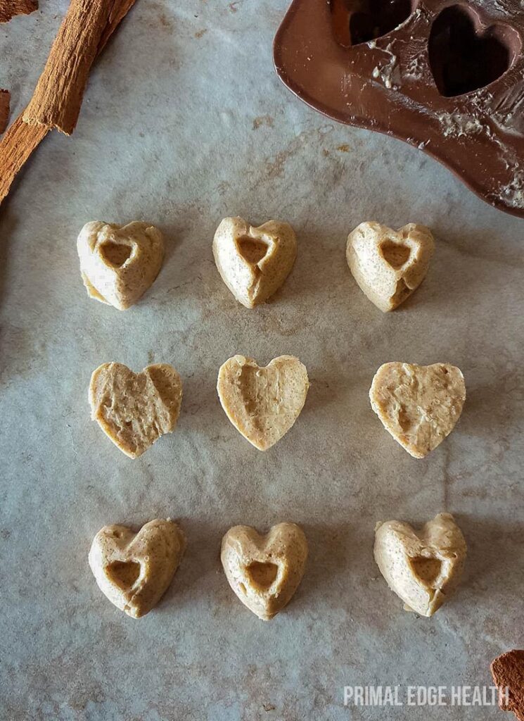 Pieces of cinnamon fat bomb on a white surface.
