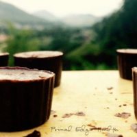 Pieces of chocolate bites on a yellow surface/