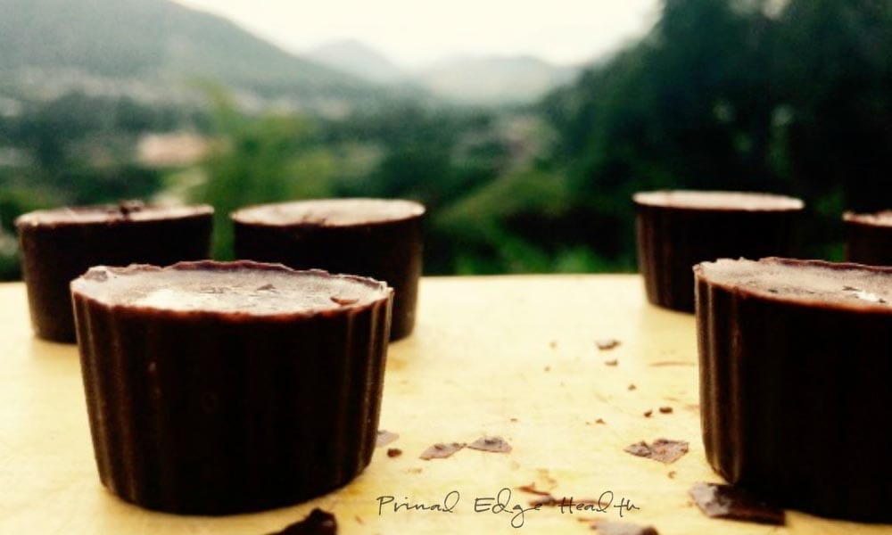 Pieces of chocolate bites on a yellow surface/