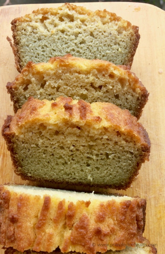 Slices of coconut flour bread on a wooden board.