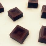 Keto chocolate maca pieces cut in squares.