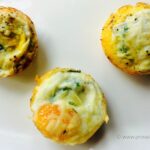 Three tomato zucchini egg cups.