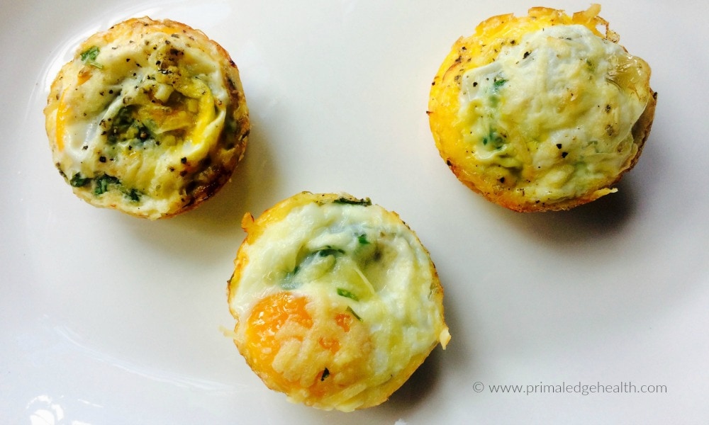 Three tomato zucchini egg cups.