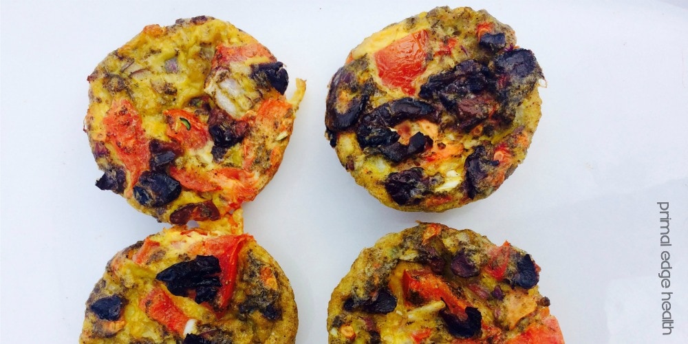 Tomato and olive egg muffins white white background.
