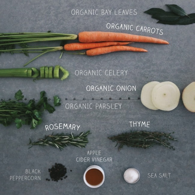 Bone broth recipe ingredients on a grey background.