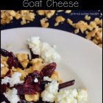 Beet green salad with cranberries and goat cheese.