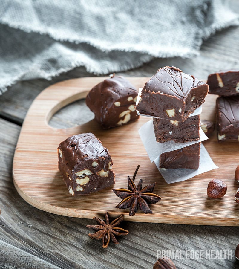 Pieces of keto nutella fat bombs on a wooden board.