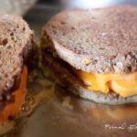 2 servings of grilled cheese being cooked.