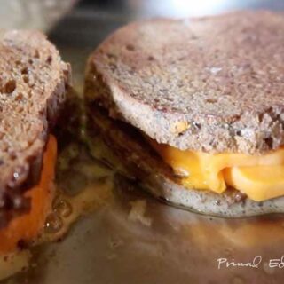 2 servings of grilled cheese being cooked.