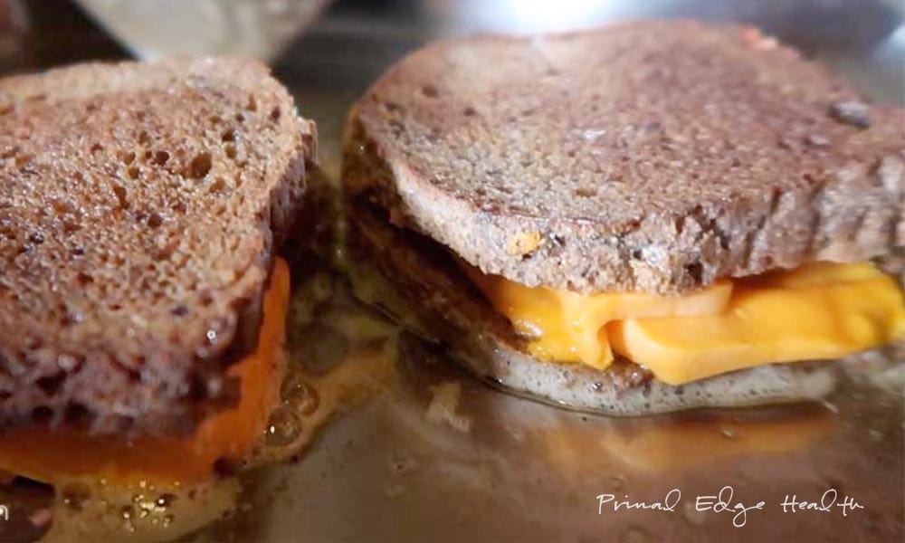 2 servings of grilled cheese being cooked.