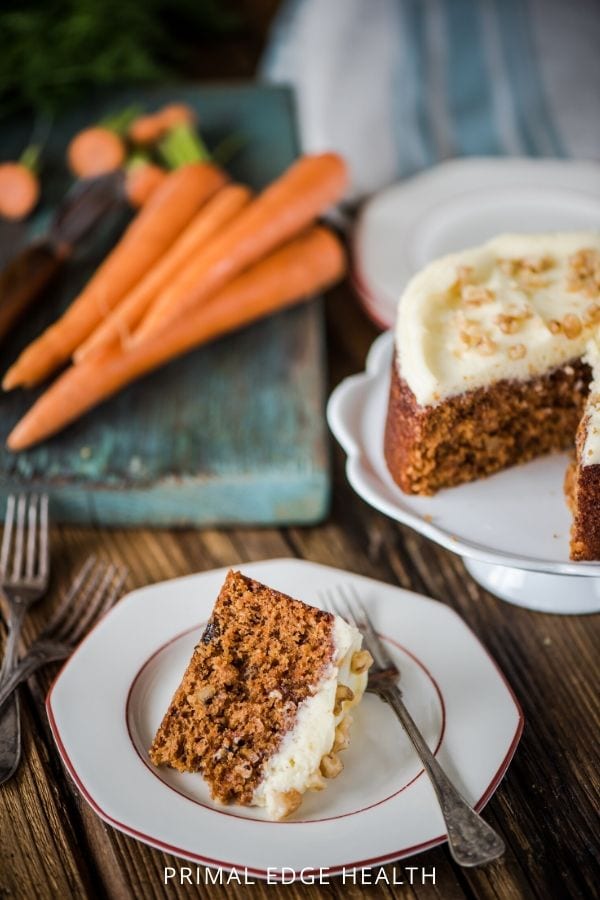 A slice of low-carb keto carrot cake on a plate with a fork.