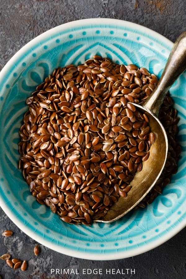 Sugar-free coffee cake with macadamia nuts in a blue bowl.