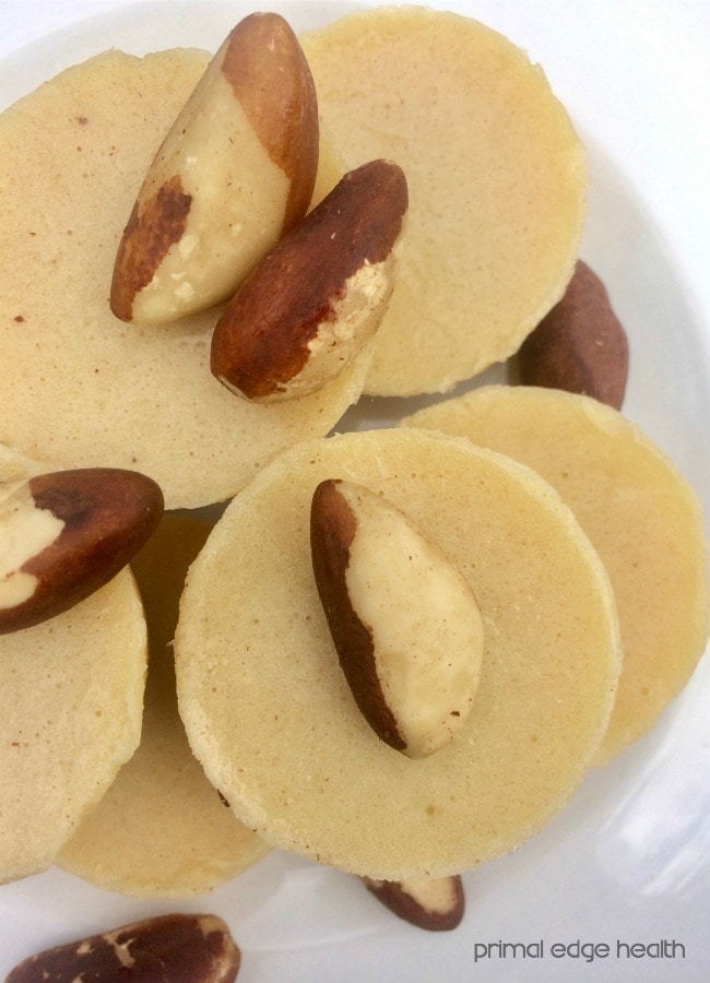 Brazil nut ketogenic white ketogenic chocolate in a pile on a white plate.