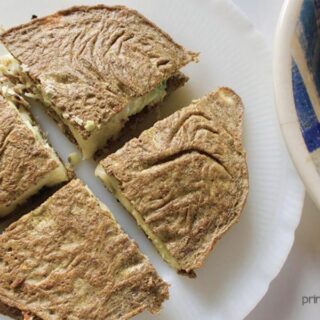 4 slices of tuna melt keto quesadilla on white plate.