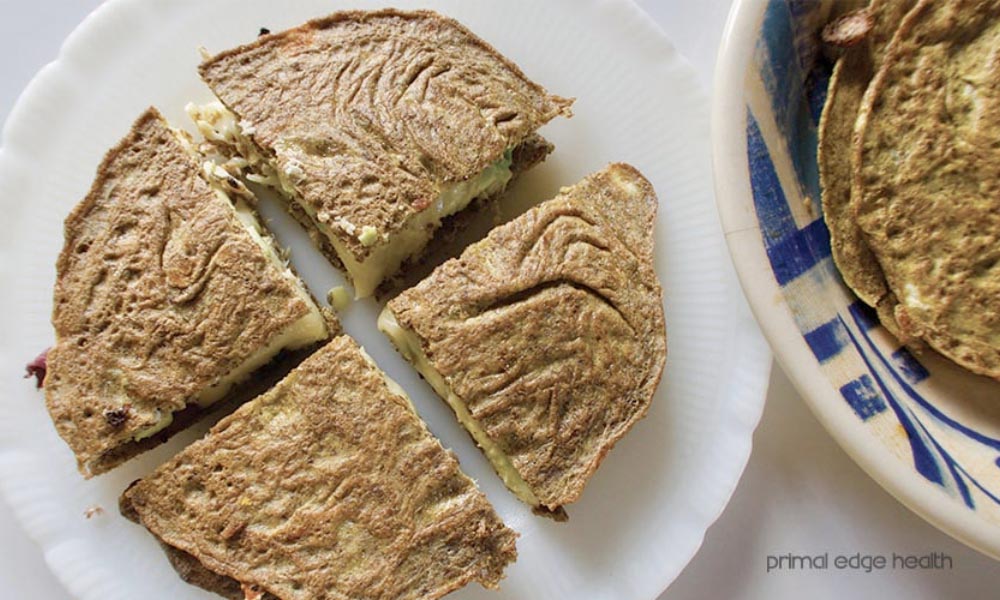4 slices of tuna melt keto quesadilla on white plate.