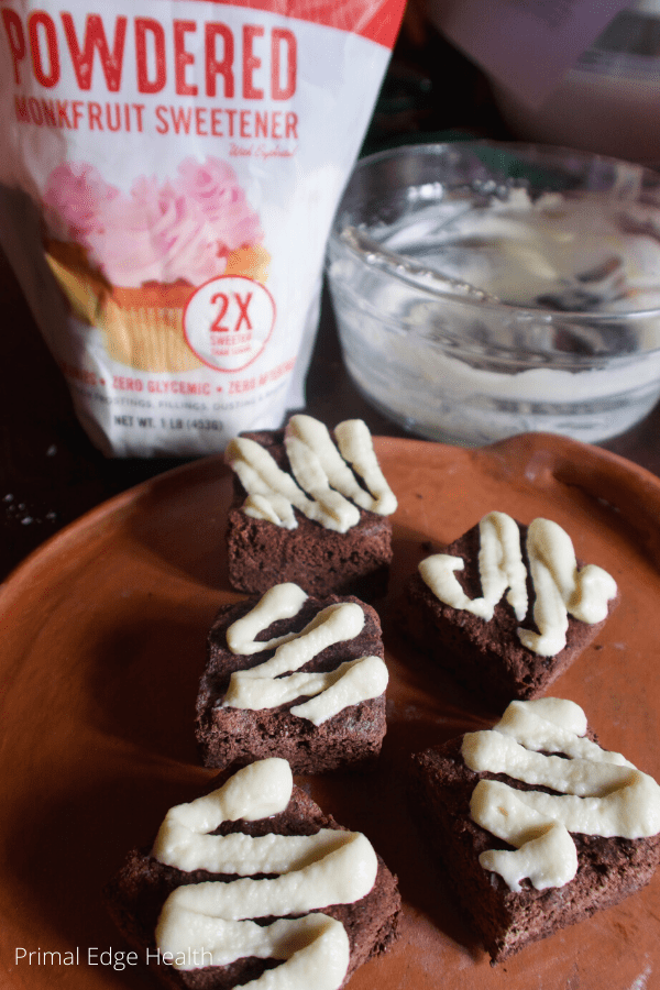 Powdered sugar icing brownies and muffins.