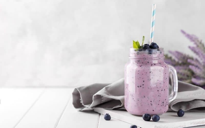 A glass of blueberry keto smoothie.