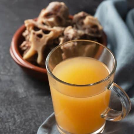 Bone broth in a glass.