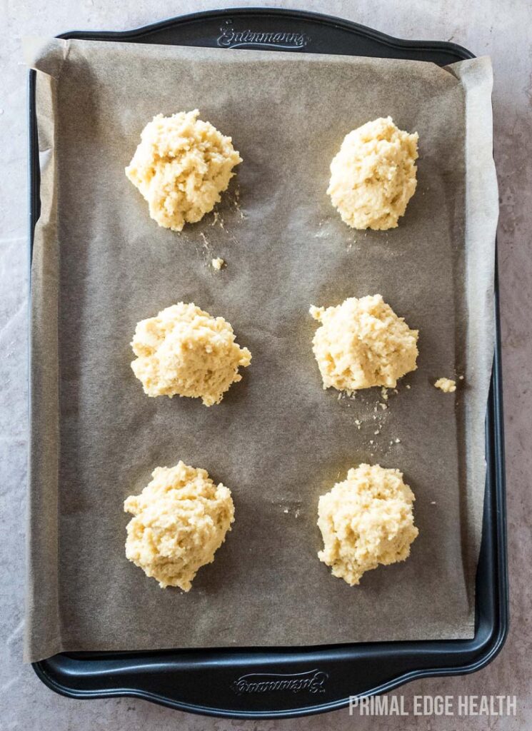 Dollops of drop biscuits arranged on baking sheet.