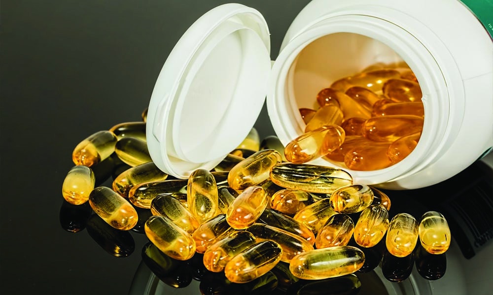 Supplements spilling out of the bottle.
