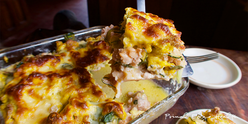 Breakfast lasagna being served at the table.