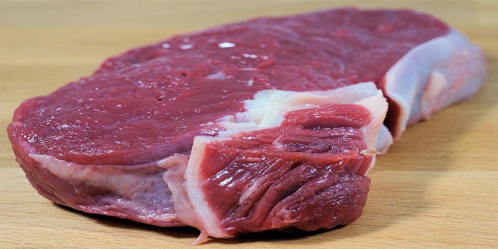 A piece of fresh raw meat.