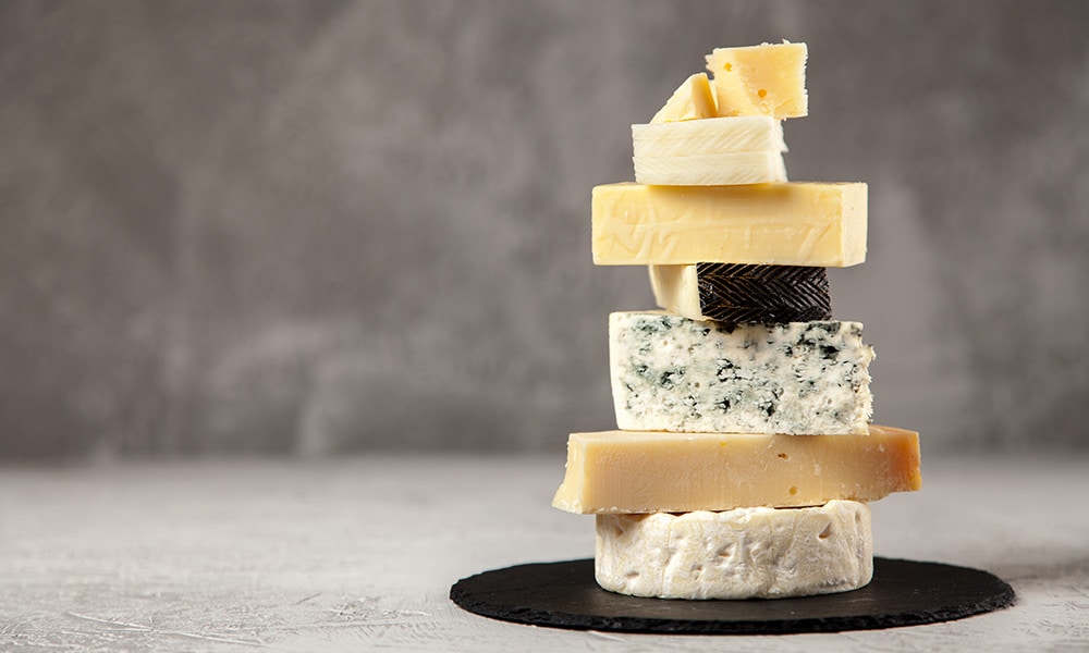 Different kinds of cheese in one stack.