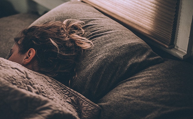 A woman sleeping comfortably.