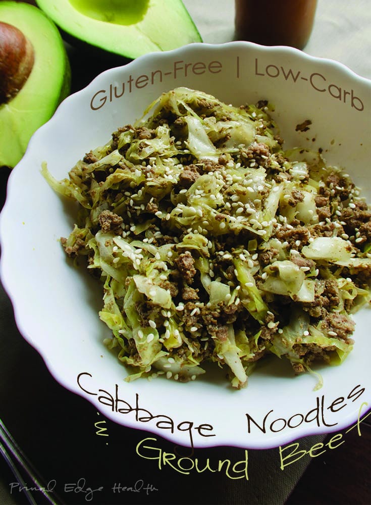 Cabbage noodles with ground beef in a white bowl.
