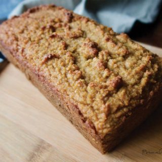 Ketogenic gingerbread on wooden cutting board with knife.