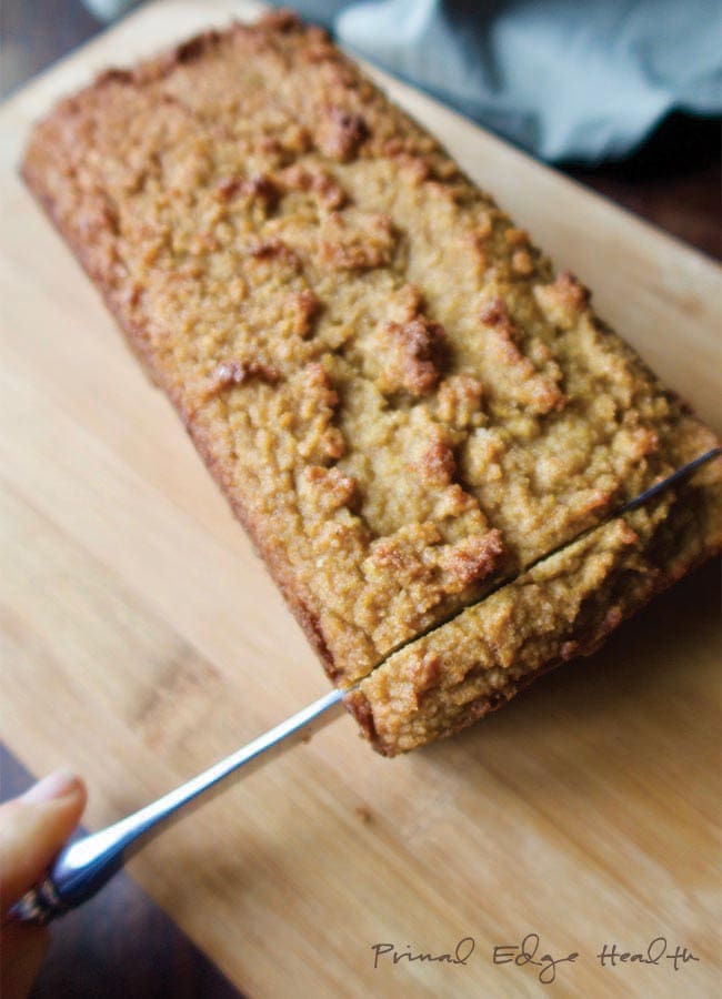 Ketogenic gingerbread loaf with one end being sliced.