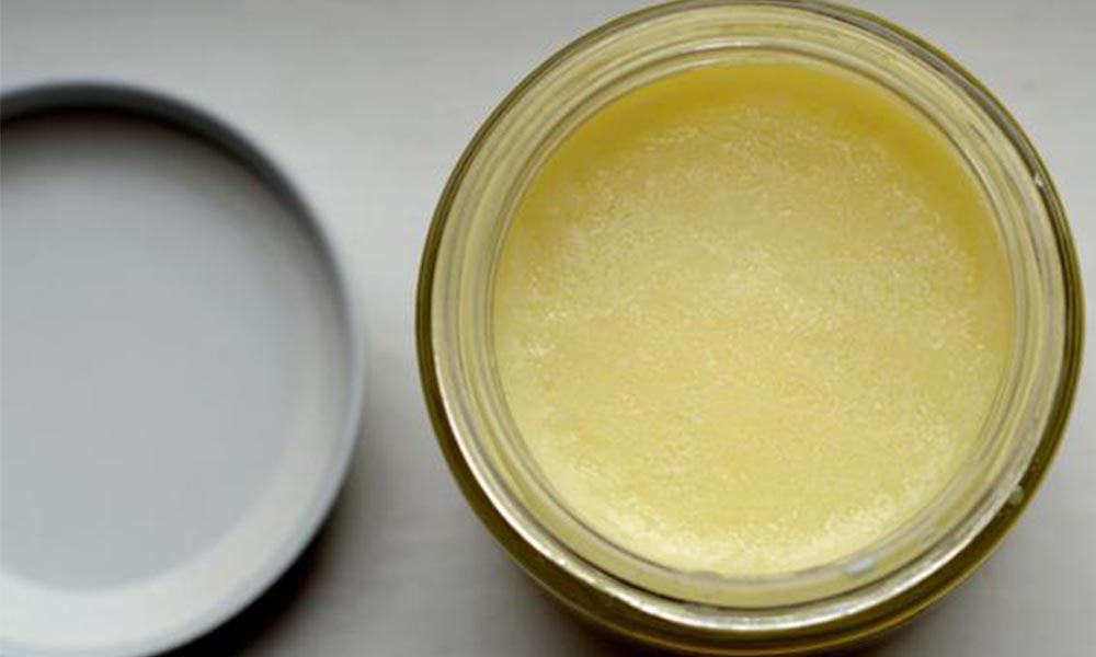 Simple tallow balm in a container without lid.