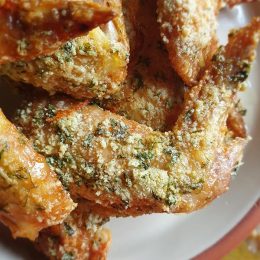 A delicious plate of keto chicken wings with herbs.