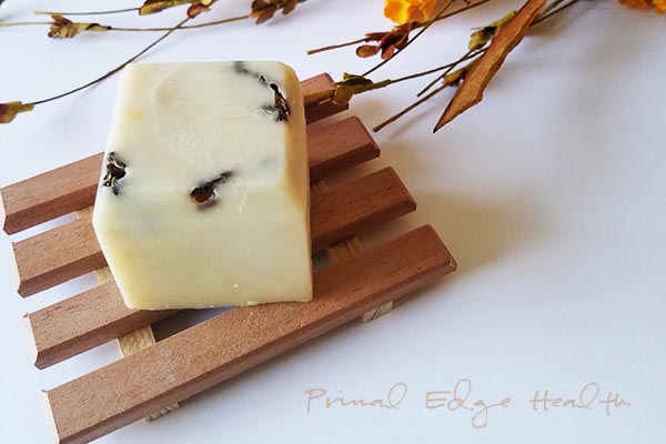 Tallow soap on a wooden rack.