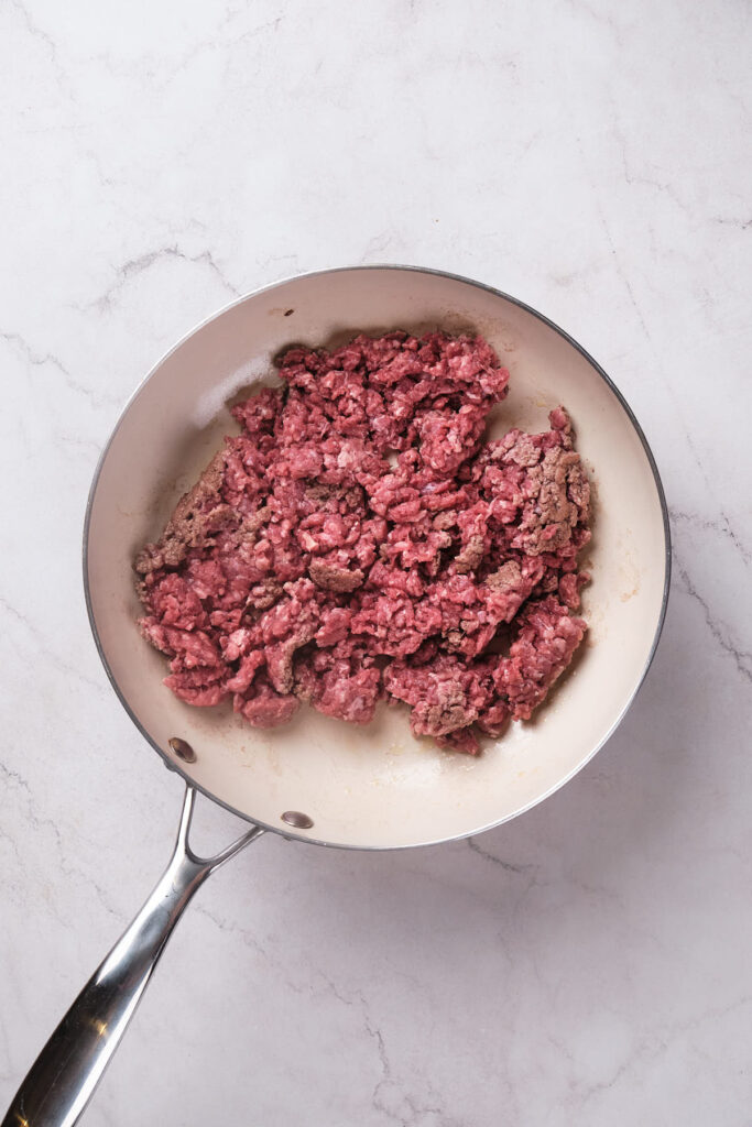 Raw ground beef for keto cheeseburger pie.