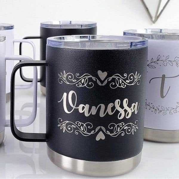 A black personalized mug with "Vanessa" printed on it.