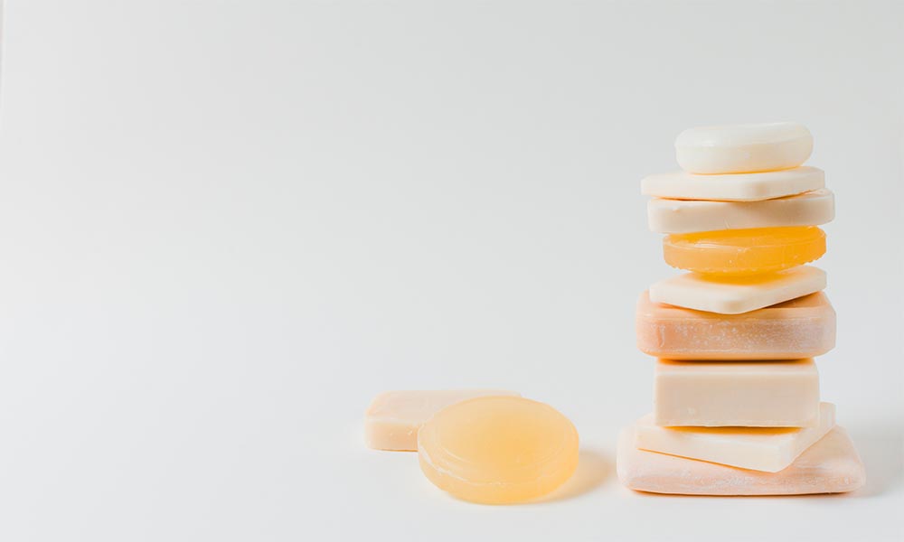 A stack of soap bars on a white background.