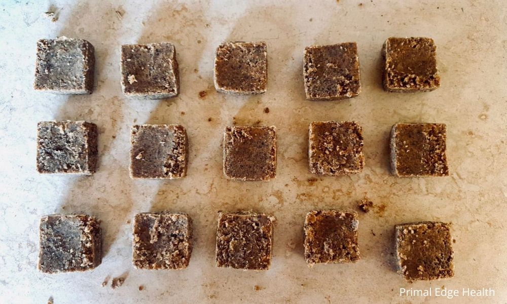 Easy homemade pemmican recipe squares on the table.