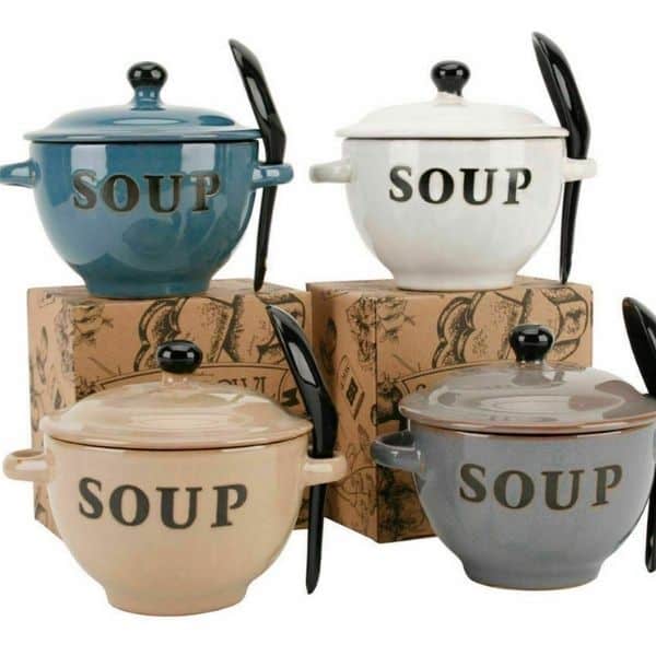 Four beef bone broth soup pots with spoons on top of boxes.