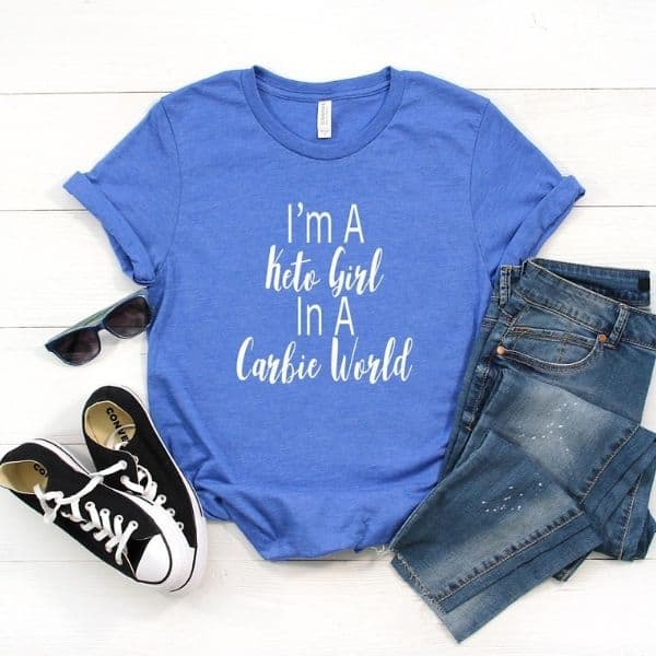A blue shirt with "I'm a keto girl in a carbie world" printed on it.