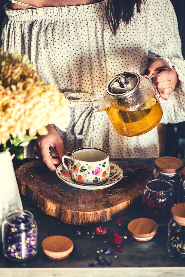 A woman pouring a tea.