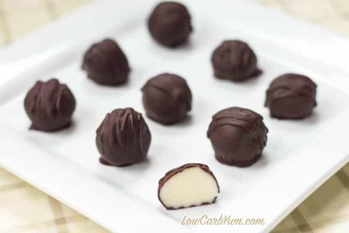 Pieces of low-carb chocolate truffles on a white plate.