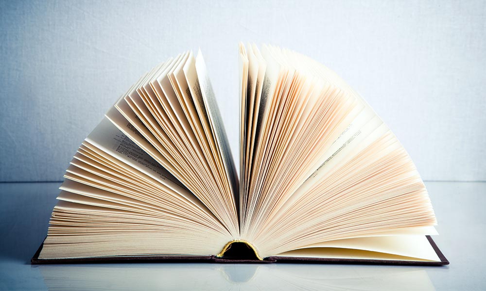 An open book sitting on a table.