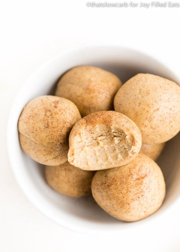 Peanut butter balls in a white bowl.